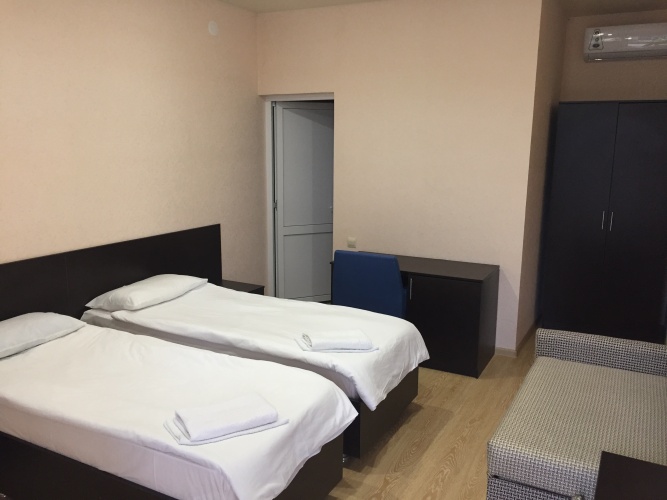 Standard Triple room with courtyard view
