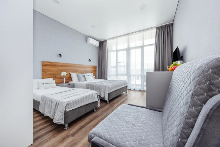 Deluxe Quadruple room with balcony
