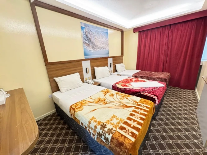 Standard Quadruple room with balcony and with city view