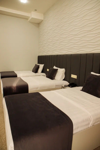 Standard Triple room with courtyard view