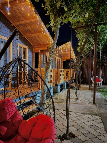 Cottage with balcony and with garden view
