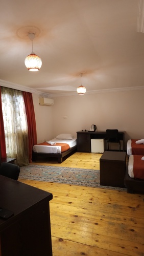 Standard Quadruple room with balcony and with city view