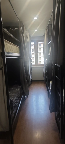 Bed in Dorm with courtyard view