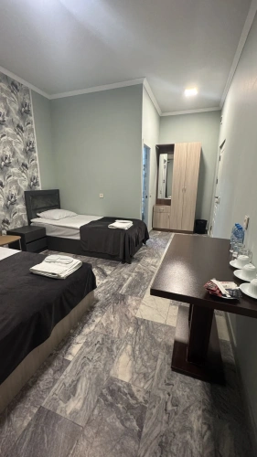 Standard Triple room with courtyard view