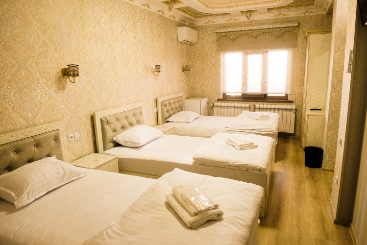 Superior Triple room with balcony and with city view