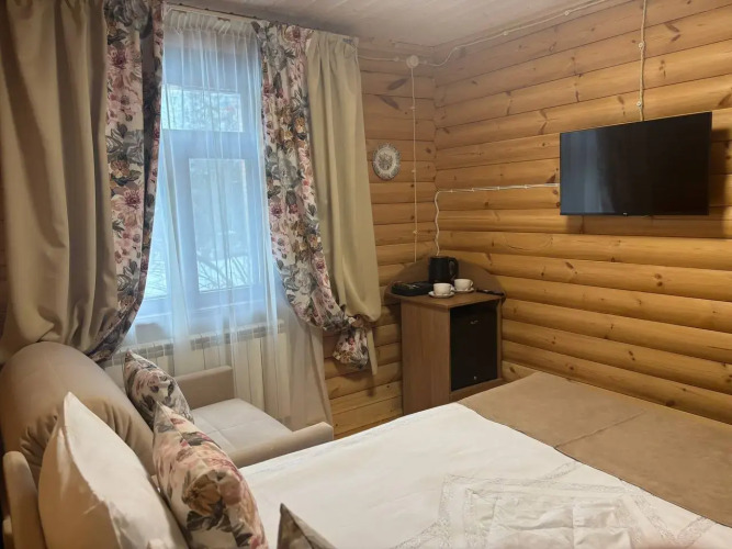 Фотография номера гостиницы Удивительная Деревня Мандроги