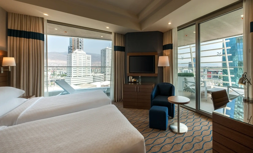 Larger Corner Twin room with balcony and with city view