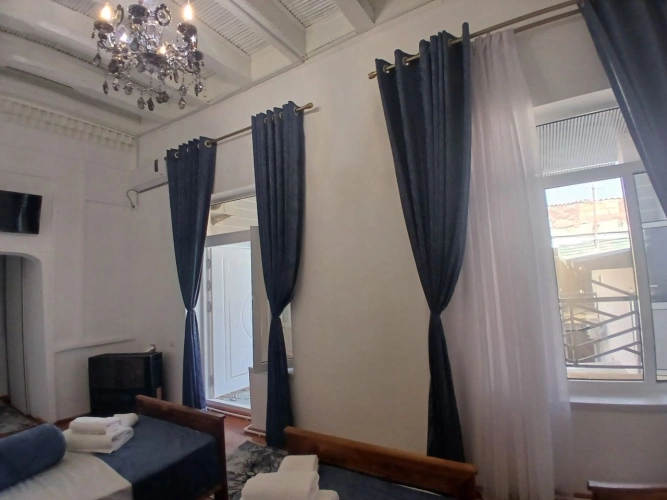 Classic Family room with balcony and with courtyard view