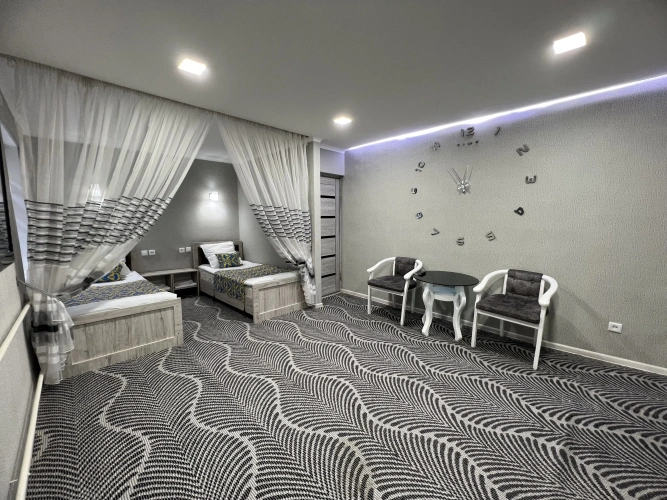 Superior Quadruple room with balcony and with city view