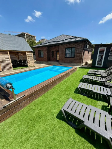 Фотография номера Коттеджа Частный дом Уютный с баней и большим бассейном