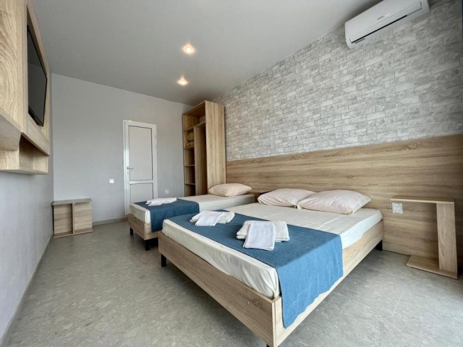Standard Triple room with balcony and with courtyard view