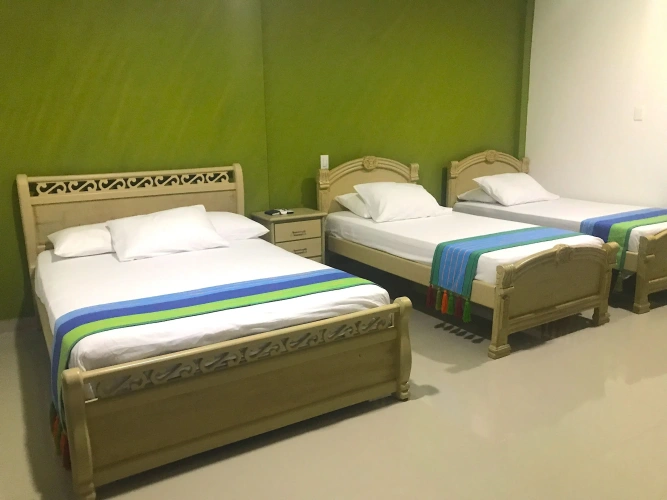 Standard Quadruple room with garden view