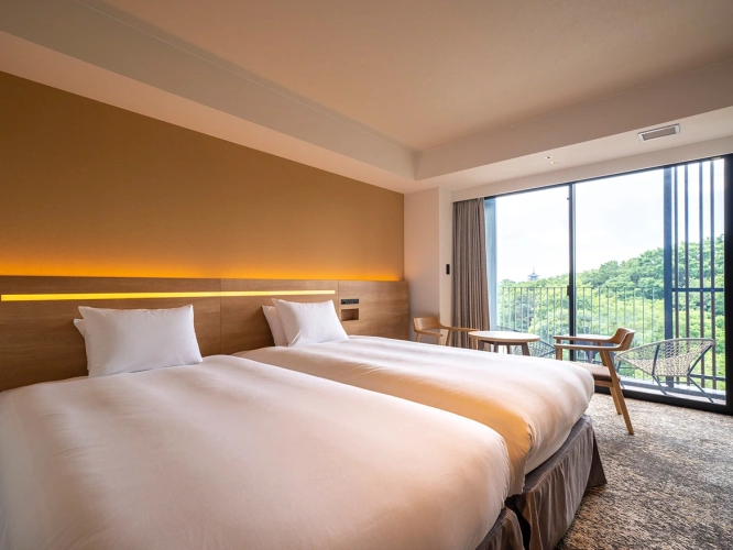 Twin room with balcony and with garden view