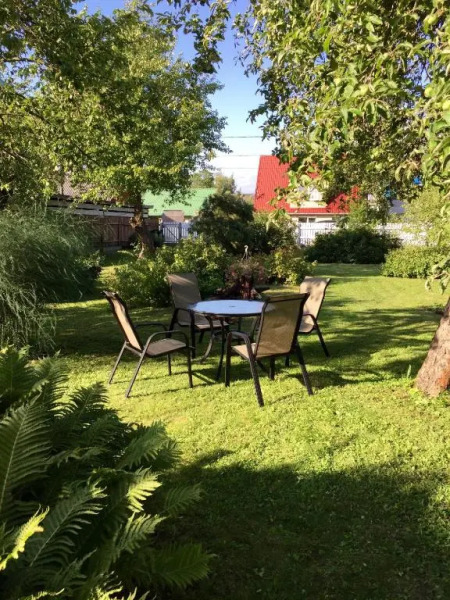 Solar Apartments - White House with garden