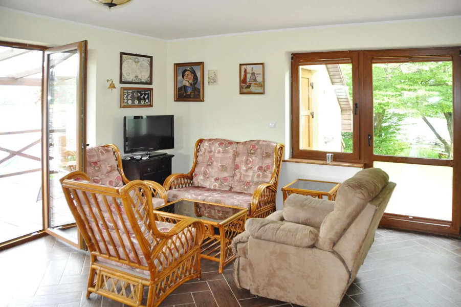 Holiday Home by Lake Rosnowskie With Boat