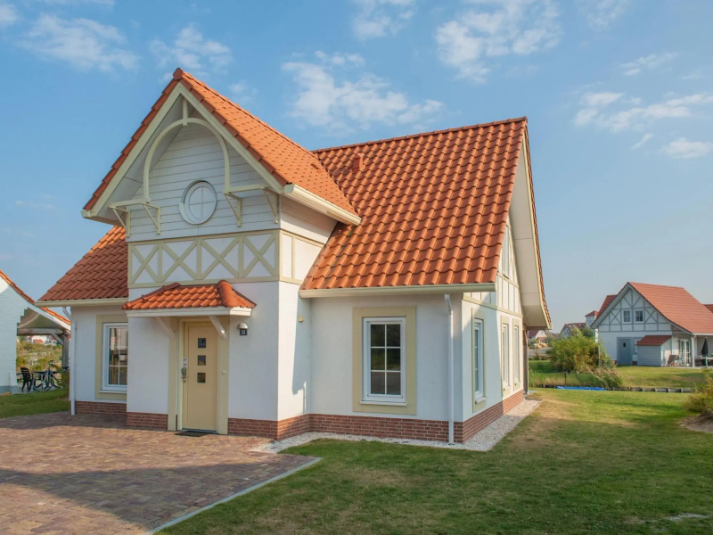 Restyled villa with sauna and rowing boat, in a holiday park, 400 m from the sea