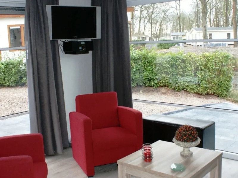 Modern chalet with two terraces and near a pond