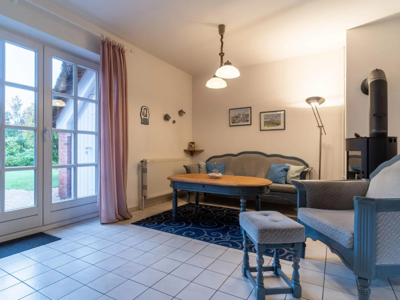 Holiday apartment with a fireplace in a thatched apartment house