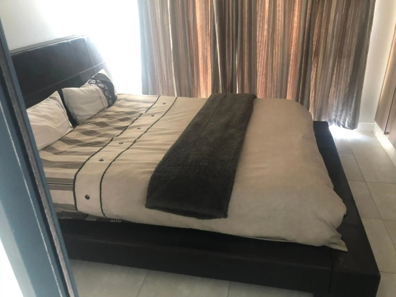 A Coastal/island experience at a Large 2 bed apartment at a Crystal Lagoon Estate.