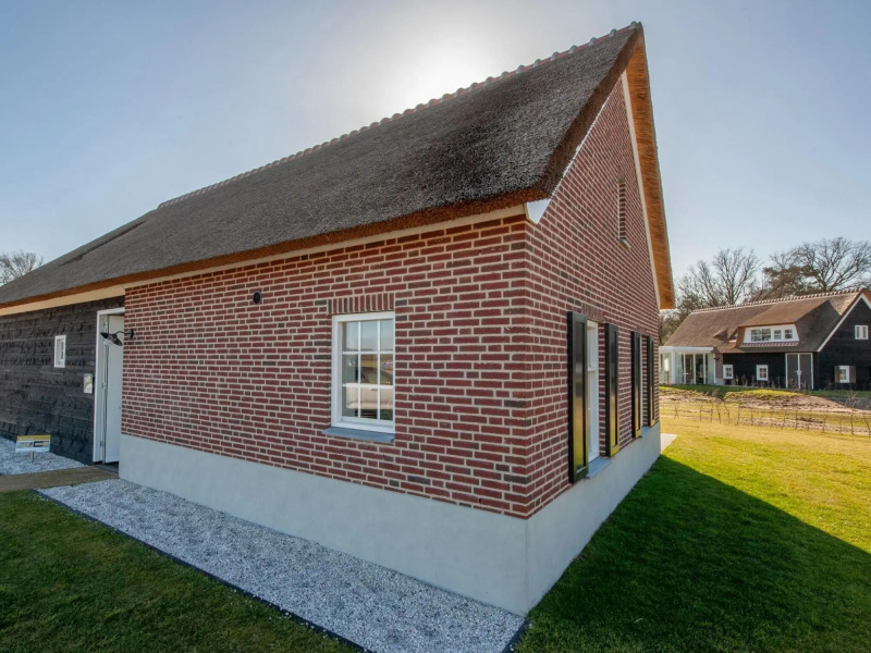 Thatched villa with two bathrooms, on a holiday park surrounded by nature
