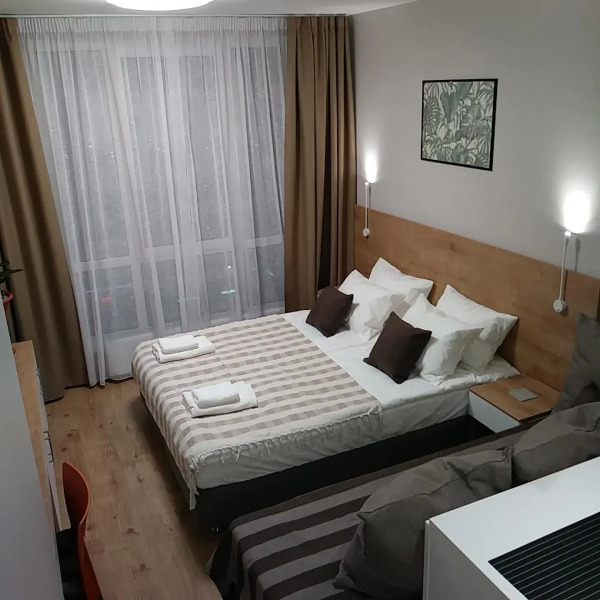 Апартаменты Уютная Студия с панорамным видом на город рядом с метро Парнас