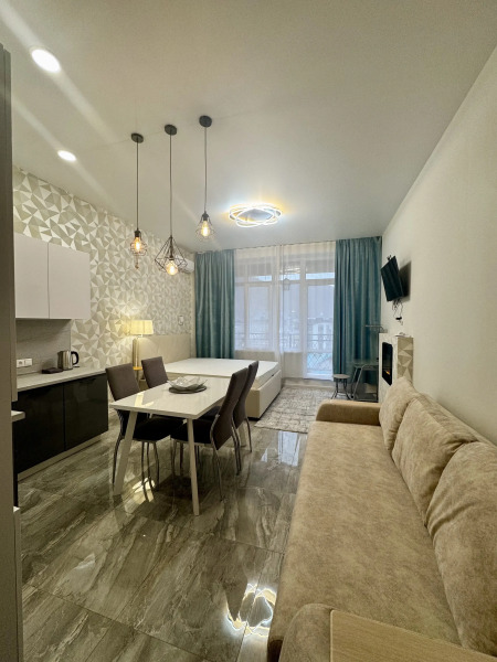 Квартира Просторная студия с террасой напротив отеля Мариотт